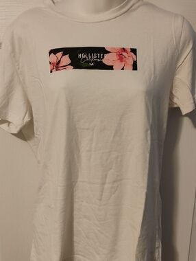 Hollister White Tee with Black Floral Logo Stripe